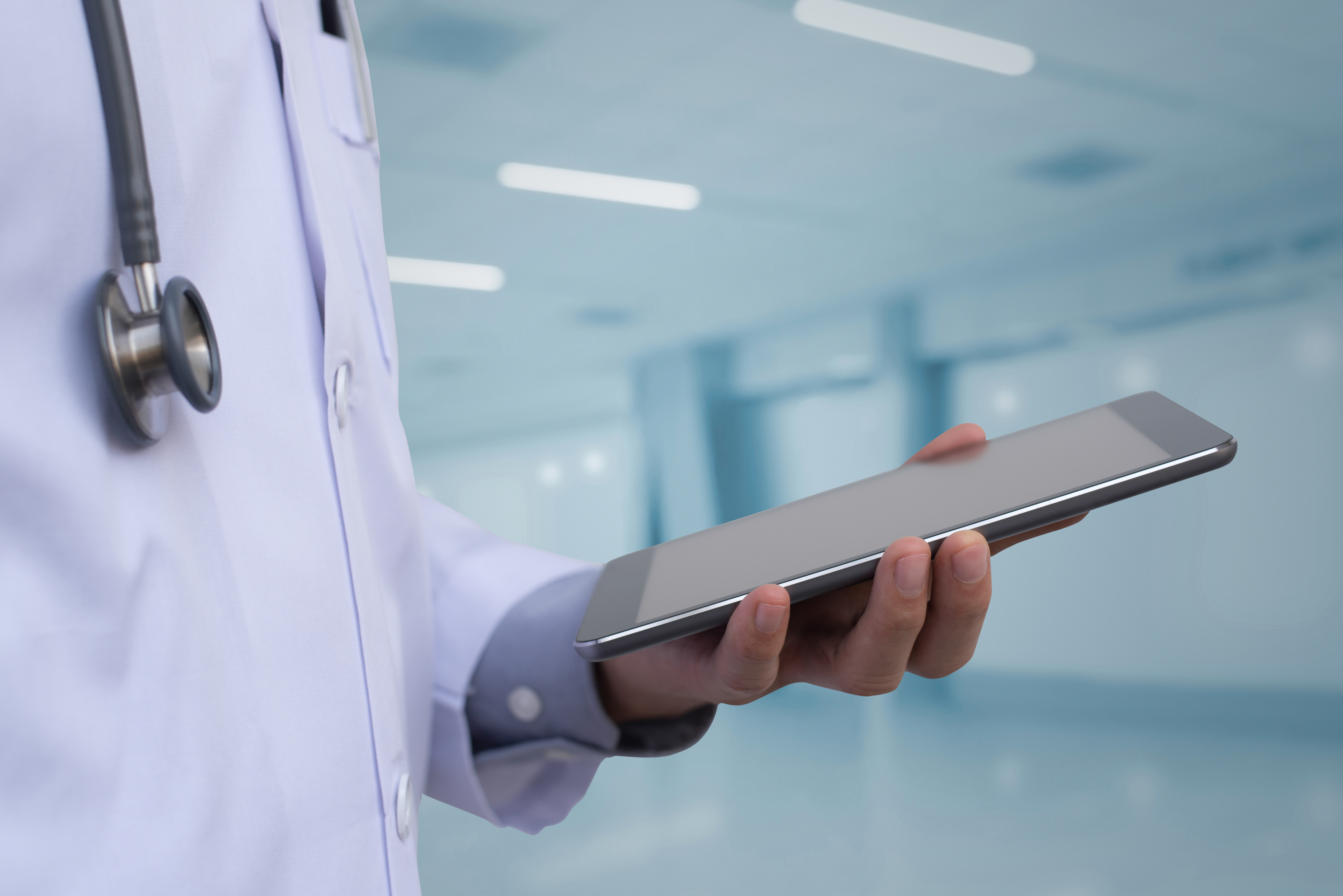 Doctor Using Digital Tablet